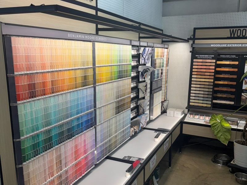 The paint department: a Benjamin Moore color-chip wall above a counter